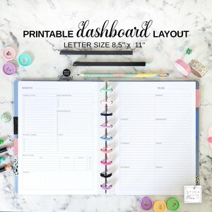 May include: Printable dashboard layout planner, letter size 8.5" x 11". The open planner shows a weekly layout with sections for appointments, to-do lists, and notes. Includes colorful disc-bound rings, pens, and decorative tape.