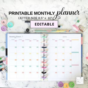 May include: A printable monthly planner with the text "PRINTABLE MONTHLY planner LETTER SIZE 8,5" x 11" EDITABLE". The planner is open to a monthly calendar view with colorful tabs and a spiral binding. Decorative items like washi tape and pens surround the planner.