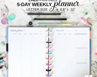 May include: A lined, printable 5-day weekly planner, letter size 8.5" x 11", open to display the weekly layout. The planner includes colorful dividers, pens, and decorative tape. The text "Weekly planner" is visible.