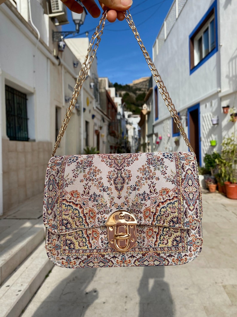 Grab this Small crossbody bag pattern Carpet style vegan shoulder bag. This Hippie bag crossbody, or Floral crossbody bag features beautiful Custom tapestry and is the perfect ethnic-flare sling bag!