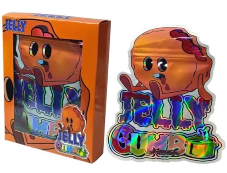 K&ouml;nnte beinhalten: Orangefarbene Schachtel und holografische T&uuml;te mit einer Cartoon-Gelee-Figur. Der Text "JELLY" und "JELLY COMBO" sind sichtbar. Die Gelee-Figur ist orange mit einem Biss und einem traurigen Gesichtsausdruck.