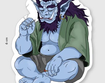 May include: A sticker featuring a blue-skinned demon with purple hair, horns, and a green robe. The demon is seated cross-legged, holding a small object. The sticker measures 4.4 cm wide and 6 cm tall.