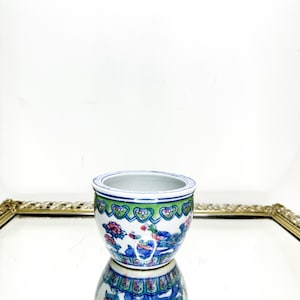 Lovely practical planter with oriental floral peony/lotus design.  Jardiniere/ cache pot. Pretty hand painted blue, pink and green pattern.
