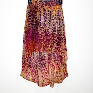 Delia’s hi-lo skirt with a vibrant, multi-colored orange purple pattern, summer skirt