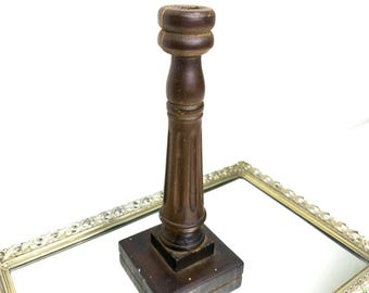 Classic dark wooden candlestick holder with a turned column and a square base, vintage wood candle holder