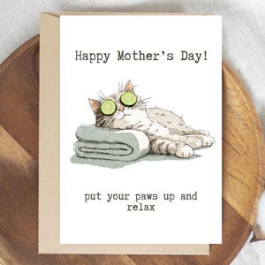 May include: A set of three ceramic mugs with a speckled, matte finish. The mugs are in shades of cream, light gray, and dark gray. Each mug has a simple, minimalist design and a rounded handle. Perfect for coffee or tea.