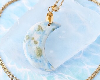 Pale Moon pendant, porcelain necklace, pale blue crescent moon.