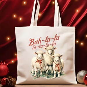 May include: White tote bag with a red and white graphic of three sheep and the text "Bah-la-la la-la-la-la".