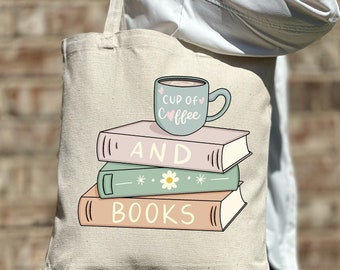 May include: A beige tote bag with a graphic of a cup of coffee and a stack of books. The text on the bag reads "Cup of Coffee and Books".