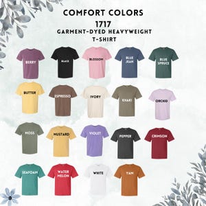 May include: A chart of 20 different colors of t-shirts, labeled with names like "Berry", "Black", "Blue Jean", "Butter", "Espresso", "Ivory", "Khaki", "Orchid", "Moss", "Mustard", "Violet", "Pepper", "Crimson", "Seafoam", "Water Melon", "White", and "Yam". The chart is titled "Comfort Colors 1717 Garment-Dyed Heavyweight T-Shirt".