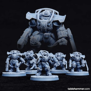 May include: A collection of light blue miniature figurines, including a large robot-like figure and several smaller figures. The figures have detailed armor and weaponry, set against a dark background. The figurines are likely for tabletop gaming.