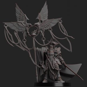 May include: A detailed, gray figurine of a warrior in ornate armor, holding a sword and spear. Above the warrior are two large eagle figures with outstretched wings, flanking a flaming emblem. The figure has a cape and intricate detailing.