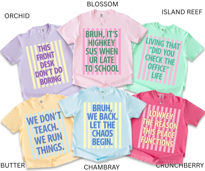 May include: Collection of six short-sleeved t-shirts in various colors, each with a unique graphic text design. Colors include orchid, butter, blossom, island reef, chambray, and crunchberry. The shirts feature phrases like "This Front Desk Don't Do Boring" and "Bruh, We Back."