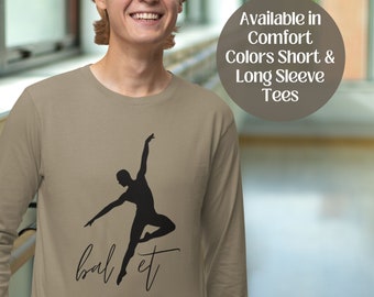 May include: Khaki long-sleeve t-shirt with a silhouette of a male ballet dancer and the text "ballet" in cursive.