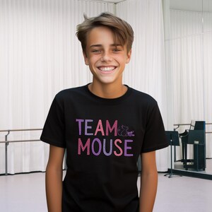 May include: A black t-shirt with a pink and purple graphic that says "TEAM MOUSE" with a small mouse illustration.