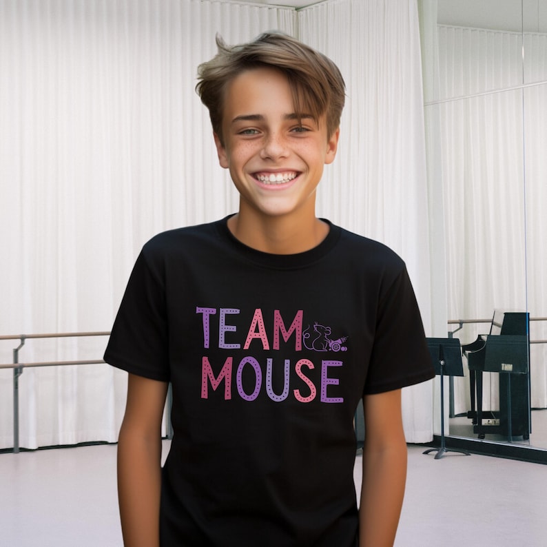 May include: A black t-shirt with a pink and purple graphic that says "TEAM MOUSE" with a small mouse illustration.