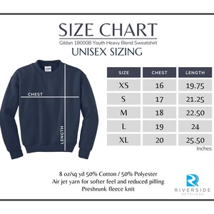 May include: Size chart for a Gildan 18000B Youth Heavy Blend Sweatshirt. The chart shows unisex sizing with chest and length measurements in inches for sizes XS, S, M, L, and XL. The fabric is 8 oz/sq yd 50% Cotton / 50% Polyester, air jet yarn for softer feel and reduced pilling, preshrunk fleece knit.