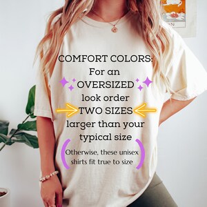 May include: A white t-shirt with the text "COMFORT COLORS: For an OVERSIZED look order TWO SIZES larger than your typical size Otherwise, these unisex shirts fit true to size" printed on it.