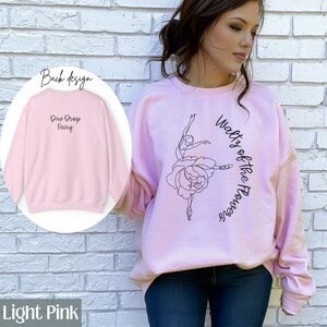 May include: Light pink sweatshirt with a ballerina graphic and the text "Waltz of the Flowers" on the front. The back of the sweatshirt has the text "Dew Drop Fairy".