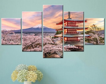 May include: A five-piece canvas print set featuring a red pagoda with a mountain in the background. The pagoda is surrounded by pink cherry blossoms. The sky is a soft pink and orange.
