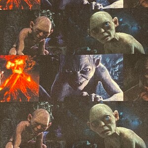 May include: A repeating pattern of a green-skinned creature with large ears and piercing blue eyes. The creature is shown in various poses, including crawling, looking up, and looking down. The background is a dark, textured fabric.