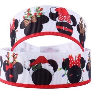 May include: Two white ribbons with a red border are stacked. The ribbons are decorated with black Mickey Mouse silhouettes wearing Christmas-themed accessories, including Santa hats, reindeer antlers, and festive bows. The design is repeated along the length of the ribbons.