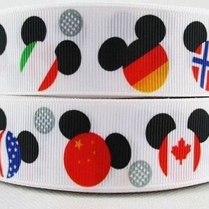 May include: White ribbon with a repeating pattern of black Mickey Mouse ears with different flags inside each ear. The flags include Canada, Germany, Norway, the United Kingdom, the United States, and China.