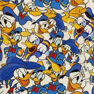 18x10” Donald Duck Fabric 100% Cotton Fabric Remnant Disney many faces of Donald Duck mad and angry