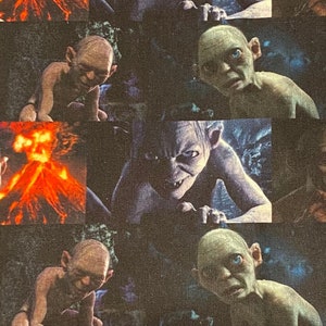 May include: A repeating pattern featuring Gollum from The Lord of the Rings. The images show Gollum in various poses, with a dark background and a fiery volcano. The color palette includes shades of green, brown, and orange.