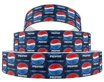 May include: Three rolls of blue and white ribbon with a repeating pattern of the Pepsi logo. The ribbon is printed with the Pepsi logo and the words "Pepsi" in white.