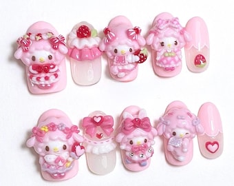May include: A set of ten pink press-on nails with 3D cartoon character designs. The nails feature various designs, including strawberries, bows, and heart accents. The nails are in a variety of shapes, including oval and almond.