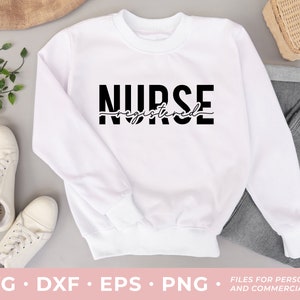 May include: White sweatshirt with black text that reads "NURSE registered" in a cursive font.