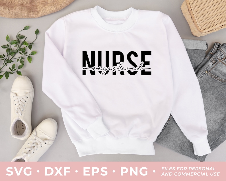 May include: White sweatshirt with black text that reads "NURSE registered" in a cursive font.