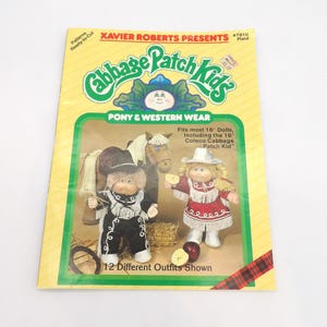 May include: A vintage Cabbage Patch Kids pattern book with the text "Pony & Western Wear." The cover features illustrations of two dolls in cowboy outfits, a horse, and the text "12 Different Outfits Shown."