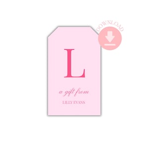 May include: A light pink gift tag with a large pink letter "L". The tag reads "a gift from LILLY EVANS" in a delicate script. A pink circle with a download arrow is in the upper right corner.