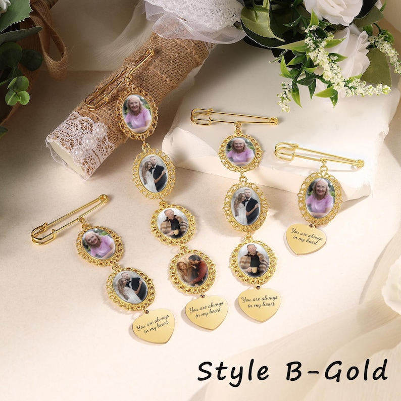 May include: Four gold-toned metal brooch pins featuring oval photo frames and heart-shaped charms. Each charm is engraved with the text "You are always in my heart." The pins display various portrait photographs of individuals and couples in ornate frames.