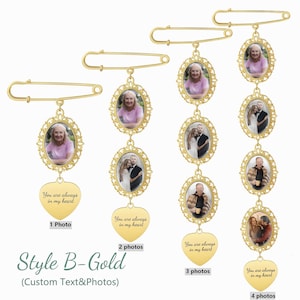 May include: Four gold-toned safety pins featuring oval filigree frames for photographs. Each pin includes a heart-shaped charm engraved with the text 'You are always in my heart'. The pins display one, two, three, or four oval photo frames respectively.