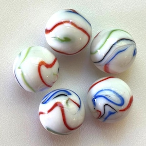 May include: Five white glass marbles with colorful swirling patterns. Each marble features red, blue, green, and black stripes. The marbles are arranged in a circular pattern, showcasing their unique designs.