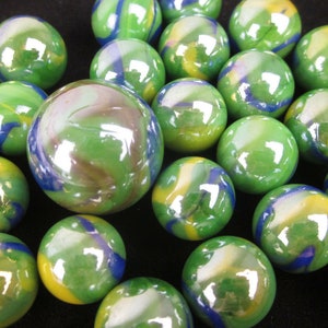May include: A collection of green, blue, and yellow marbles with swirls of color. The marbles are shiny and reflective.