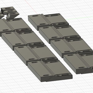 Puede incluir: Un juego de 18 escuadras de esquina de pl&aacute;stico gris, dise&ntilde;adas para conectar dos piezas de madera en un &aacute;ngulo de 90 grados. Las escuadras est&aacute;n dispuestas en dos filas de nueve, con cada escuadra que presenta m&uacute;ltiples agujeros para tornillos o clavos.