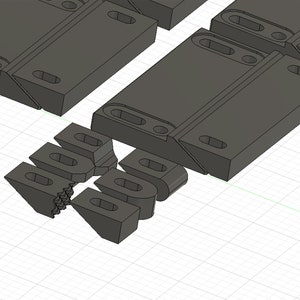 Puede incluir: Un conjunto de bloques de construcci&oacute;n de pl&aacute;stico gris que se interconectan. Los bloques est&aacute;n dise&ntilde;ados para conectarse entre s&iacute; para crear diversas estructuras.