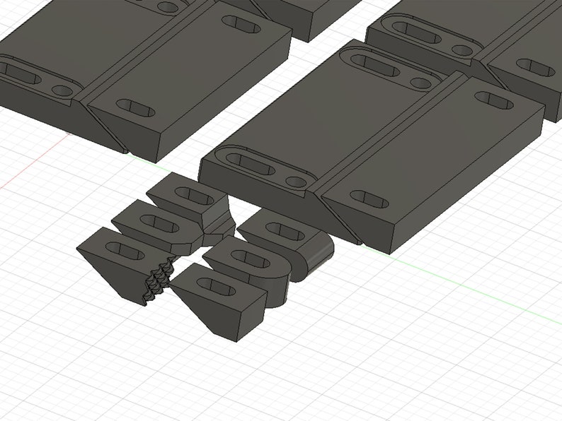 Puede incluir: Un conjunto de bloques de construcci&oacute;n de pl&aacute;stico gris que se interconectan. Los bloques est&aacute;n dise&ntilde;ados para conectarse entre s&iacute; para crear diversas estructuras.