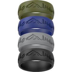 May include: Four silicone rings in olive green, blue, gray, and black. Each ring features a mountain and tree design. The rings are stacked vertically, showcasing the different color options and the detailed landscape pattern.