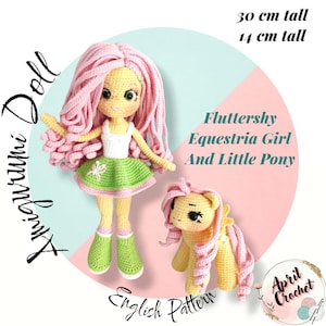 May include: A handmade amigurumi doll and pony, both crocheted. The doll is 11.8 inches tall, with pink hair, a white top, green skirt, and green boots. The pony is 5.5 inches tall, with yellow and pink details. The text says "Fluttershy Equestria Girl And Little Pony."