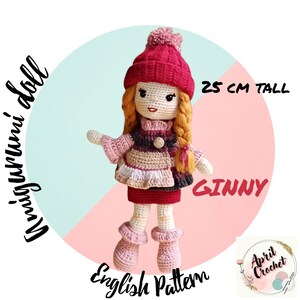 May include: Crochet doll pattern for a 25 cm tall doll named Ginny. The doll is wearing a red and white striped sweater, a pink skirt, and a red hat with a white pom-pom. The doll has long blonde hair and brown eyes. The pattern is available in English.