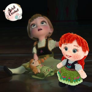 Op de afbeelding: Een gehaakte pop van het personage Anna uit de film Frozen, met rood haar, een groene jurk en een zwart lijfje. De pop staat naast een grotere geanimeerde versie van Anna. De afbeelding bevat de tekst "April Crochet".