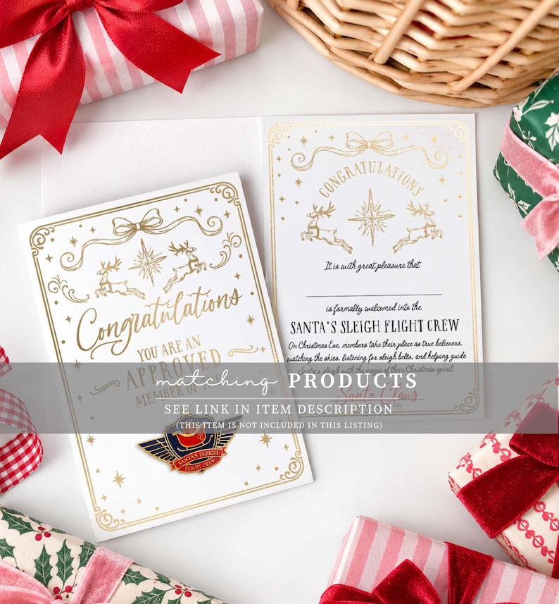 May include: A white greeting card with gold foil accents featuring the text Congratulations, You Are An Approved Member Of, and Santa's Sleigh Flight Crew. The card includes illustrations of reindeer, a star, and a bow, with a metal pin attached.