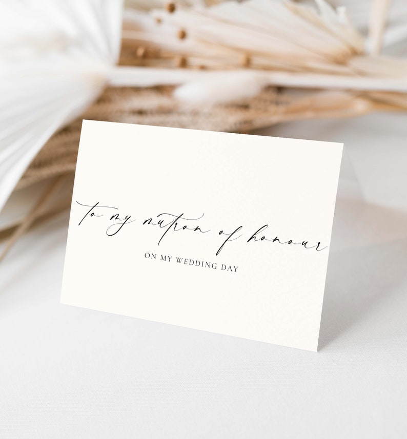 May include: A white card with black calligraphy that reads "To my matron of honour on my wedding day".