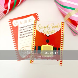 May include: Two Christmas-themed cards with text. One reads "Wish List" with a list of items. The other says "Secret Santa Selector" with a Santa Claus design. Gift wrap with red and pink stripes is in the background.