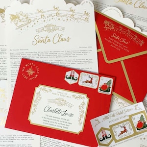 May include: A red envelope addressed to Charlotte Louise with gold foil accents, featuring North Pole postage stamps. Included is a letterhead from the desk of Santa Claus with a gold sleigh illustration and printed text detailing a Christmas message.